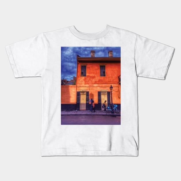 Sunny Days and Blue Skies on a New Orleans French Quarter Street with Orange Iconic Architecture and Nola People Walking in Southern Louisiana Kids T-Shirt by Little Shop of Nola